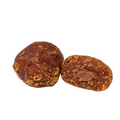 Whole and halved Palmaria Date Lotus Rolls showing the Nutella filling